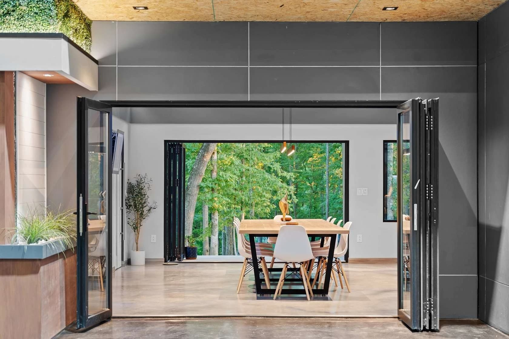 Modern barndominium interior with folding glass doors and elegant finishes